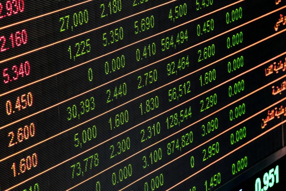 Singapore stock market trading floor with financial charts showing dividend stock performance