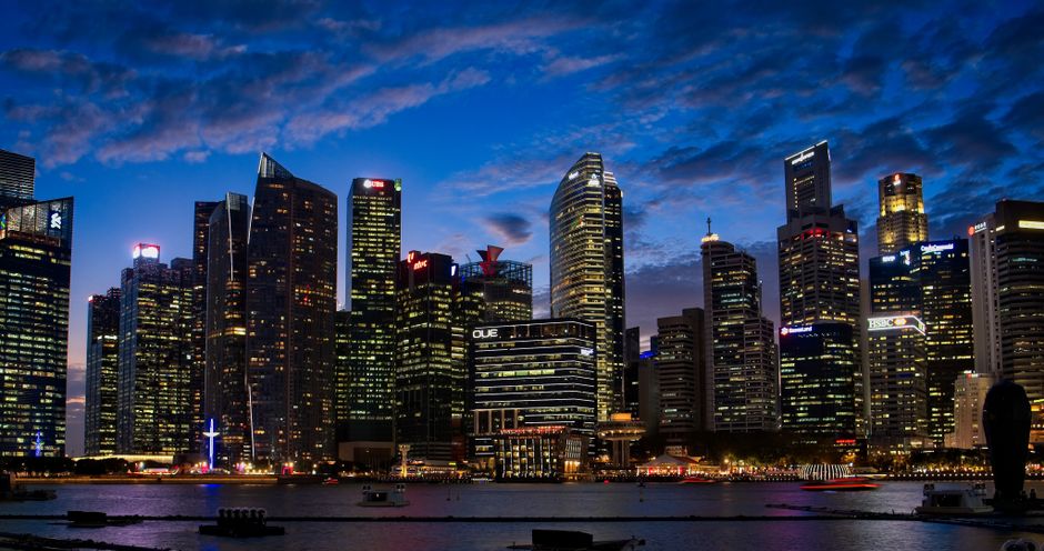 Investment options for Singapore permanent residents: Singapore financial district skyline at night