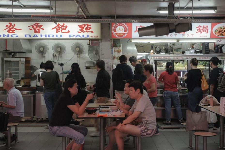 CDC Vouchers Singapore 2026 - hawker centre customers paying for meals with vouchers