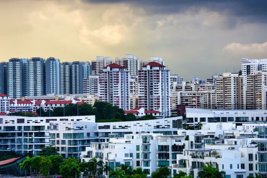 REIT vs physical property Singapore 2026 - high-rise residential buildings in Singapore skyline
