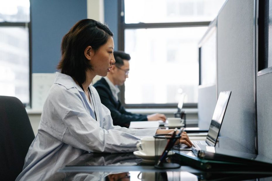 Singapore probation period 2026 guide: employee reviewing employment contract at office desk